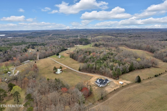 birds eye view of property with a rural view