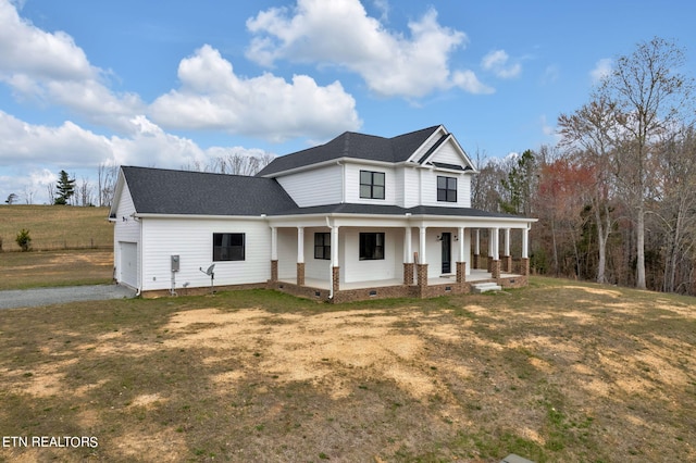 view of front facade featuring covered porch and a front lawn