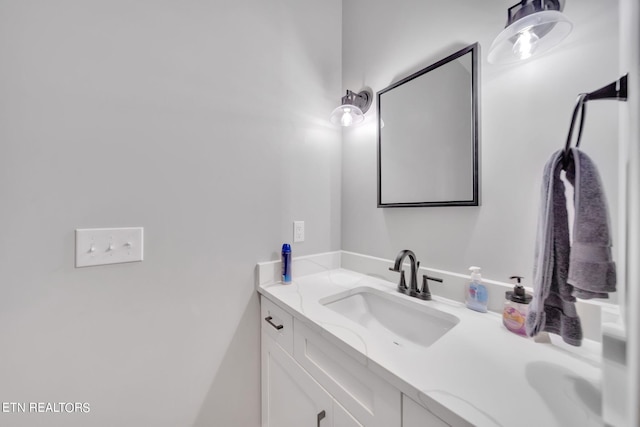 bathroom with vanity with extensive cabinet space