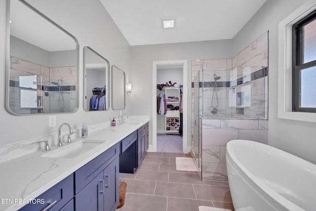 bathroom featuring tile flooring, shower with separate bathtub, and dual bowl vanity