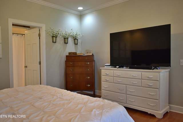 bedroom with baseboards, ornamental molding, dark wood-type flooring, and recessed lighting