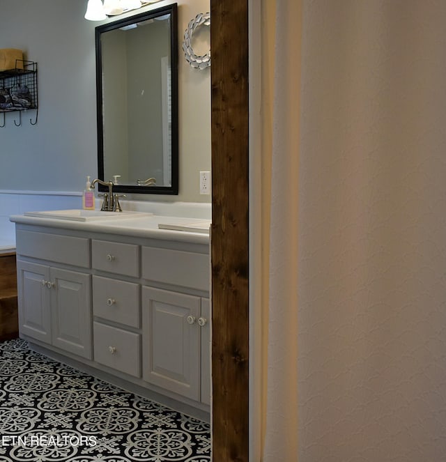 bathroom with vanity and tile patterned floors