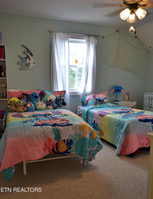 bedroom featuring ceiling fan and carpet floors