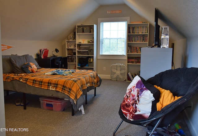 carpeted bedroom featuring lofted ceiling