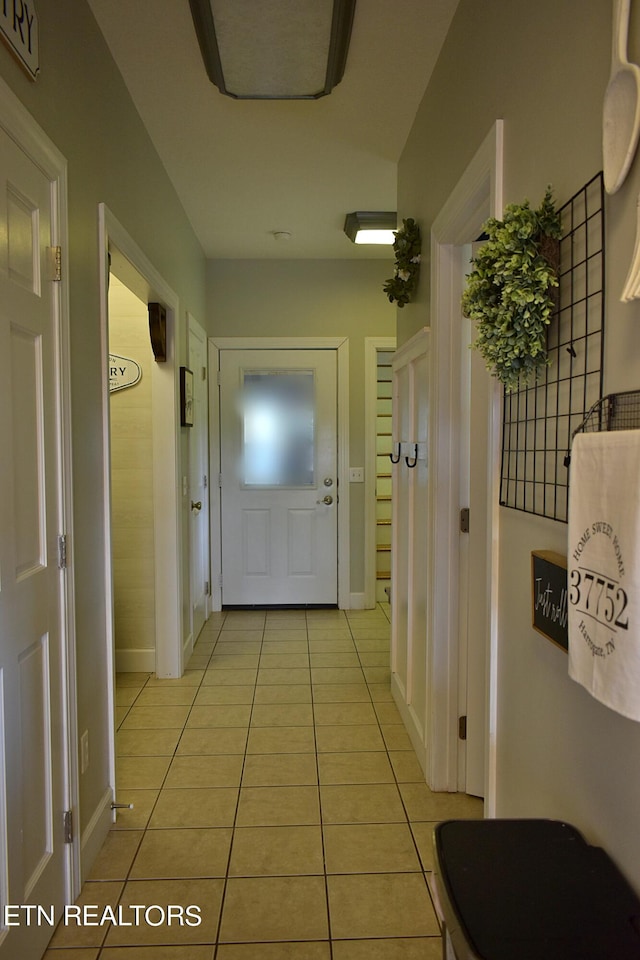 hallway with light tile patterned flooring