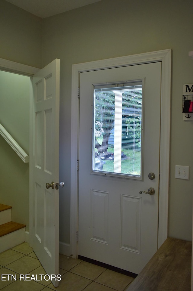 entryway featuring light tile patterned floors