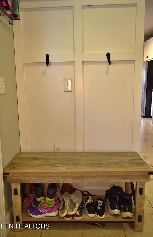 mudroom with light tile patterned floors