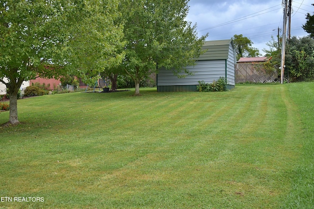 view of yard with a storage unit and an outdoor structure