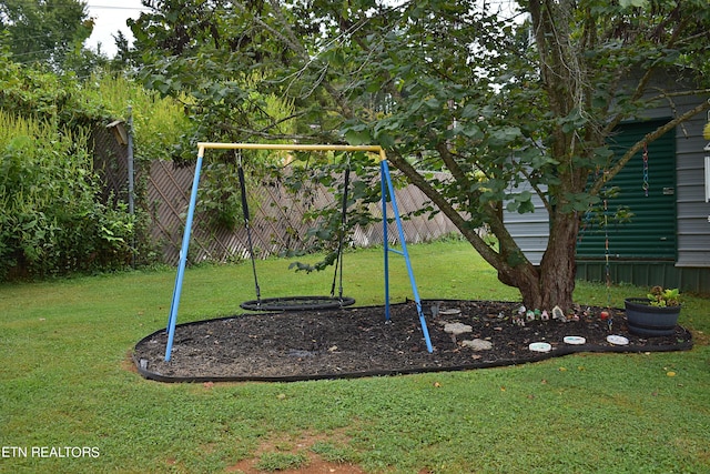 view of jungle gym featuring a yard