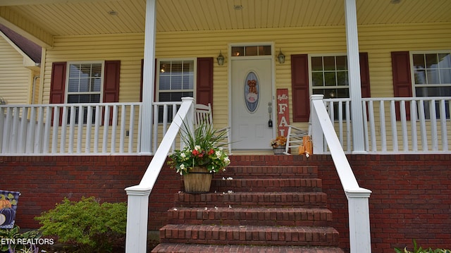 property entrance with covered porch