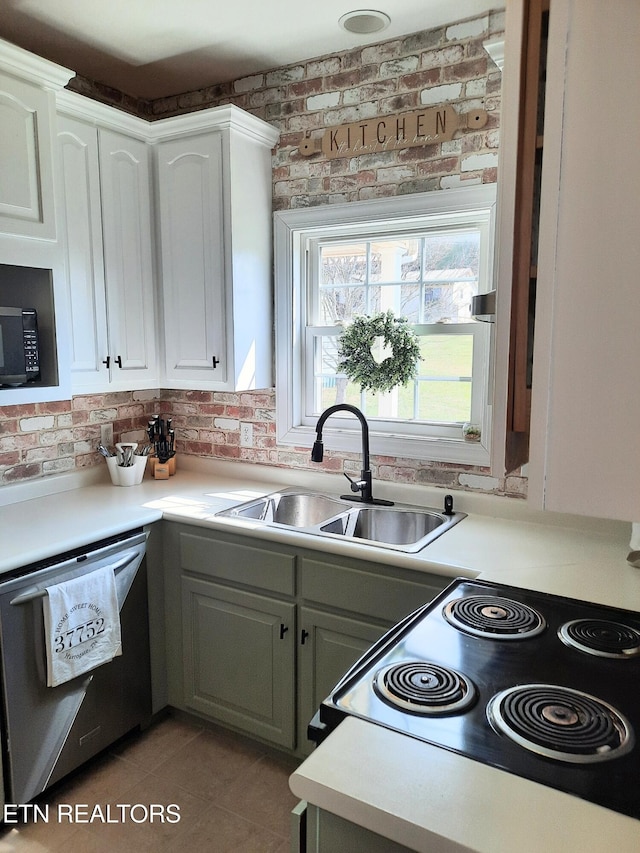 kitchen featuring a sink, electric range, white cabinetry, and dishwasher