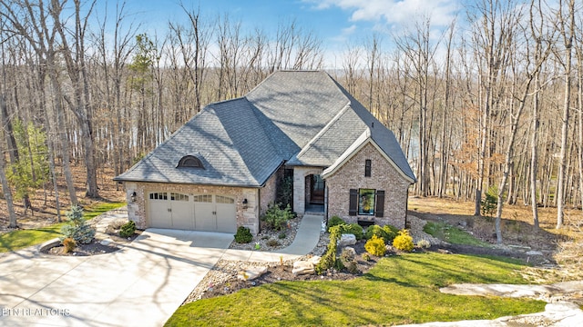 view of front of property with a front lawn and a garage