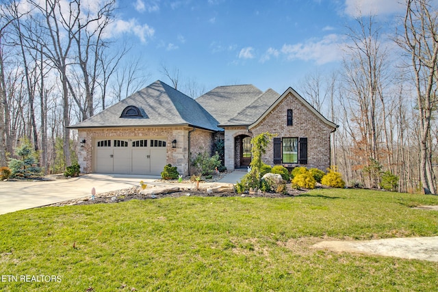 french country inspired facade with a front lawn and a garage