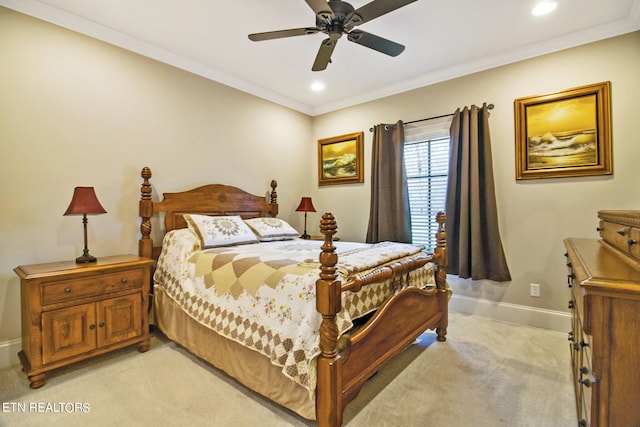 carpeted bedroom with crown molding and ceiling fan