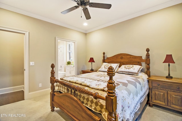 bedroom with ornamental molding, connected bathroom, light carpet, and ceiling fan