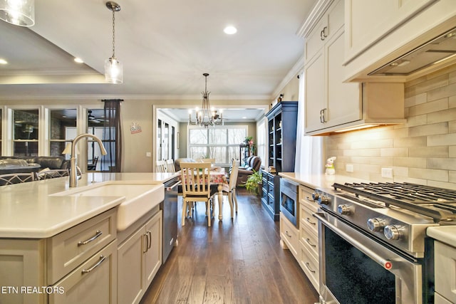 kitchen featuring decorative light fixtures, premium range hood, backsplash, dark hardwood / wood-style floors, and an inviting chandelier