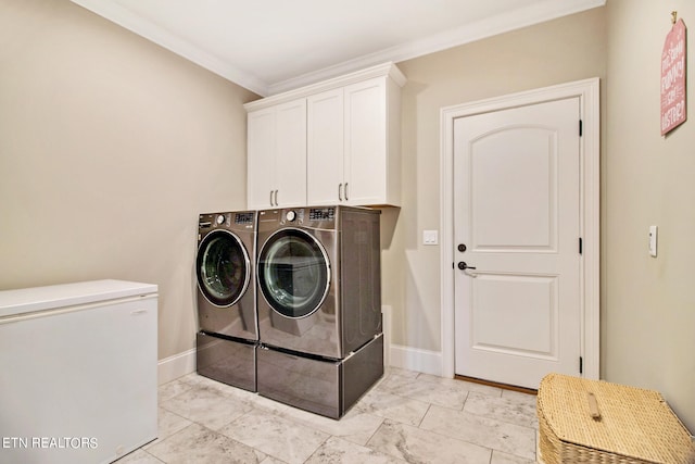 laundry area with independent washer and dryer, crown molding, cabinets, and light tile floors