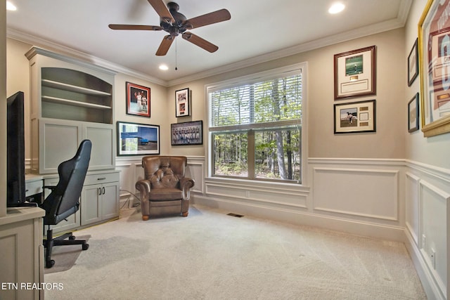 office space featuring ceiling fan, light carpet, and crown molding