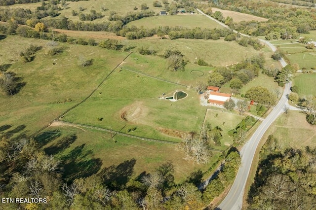 birds eye view of property featuring a rural view