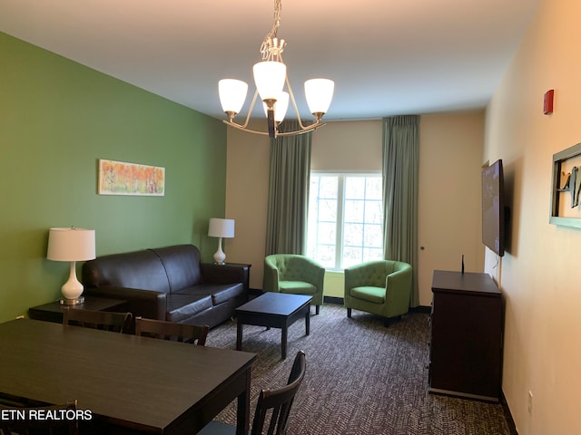 carpeted living room featuring a chandelier