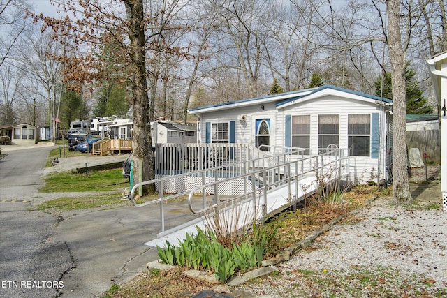 view of front of home featuring a wooden deck