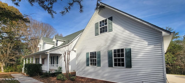 view of home's exterior featuring a porch