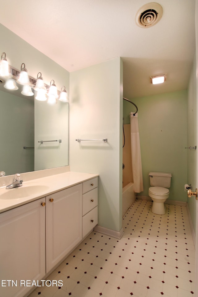 full bathroom with vanity, toilet, and shower / tub combo