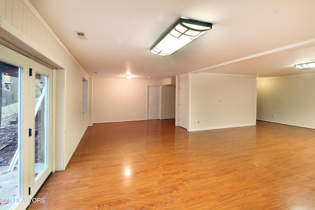 empty room with hardwood / wood-style flooring