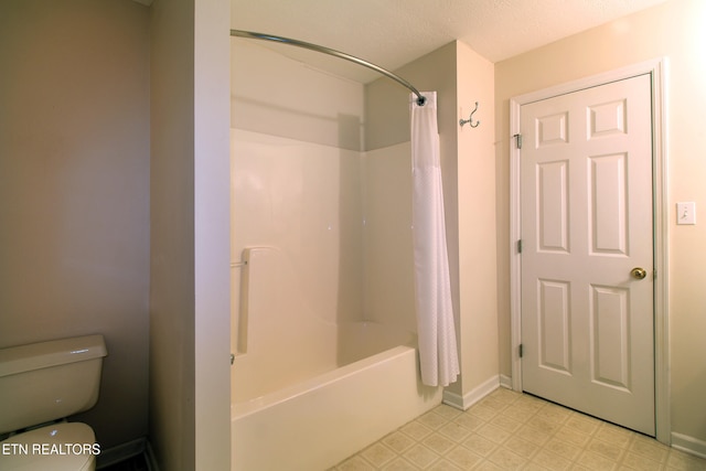 bathroom with shower / bath combination with curtain and toilet