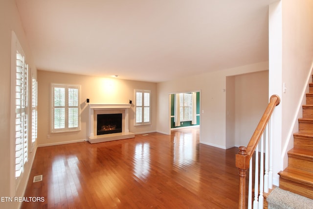 unfurnished living room featuring hardwood / wood-style floors