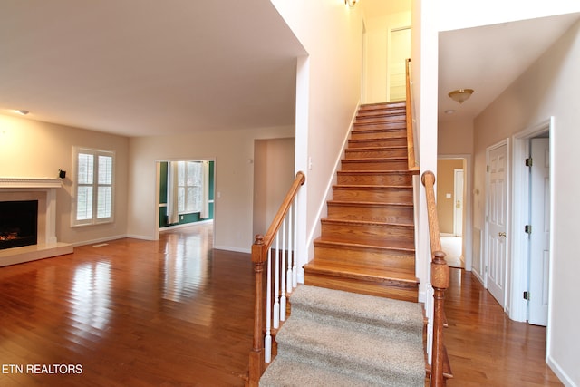 stairs with wood-type flooring