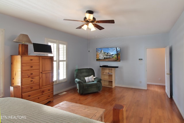 bedroom with light wood-type flooring and ceiling fan