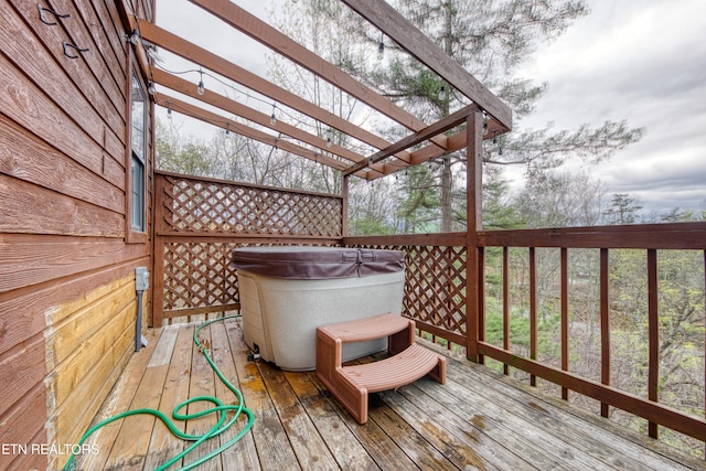 deck with a hot tub