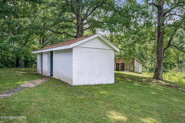 garage featuring a yard