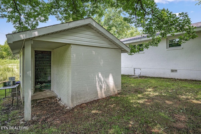 view of side of property featuring a shed