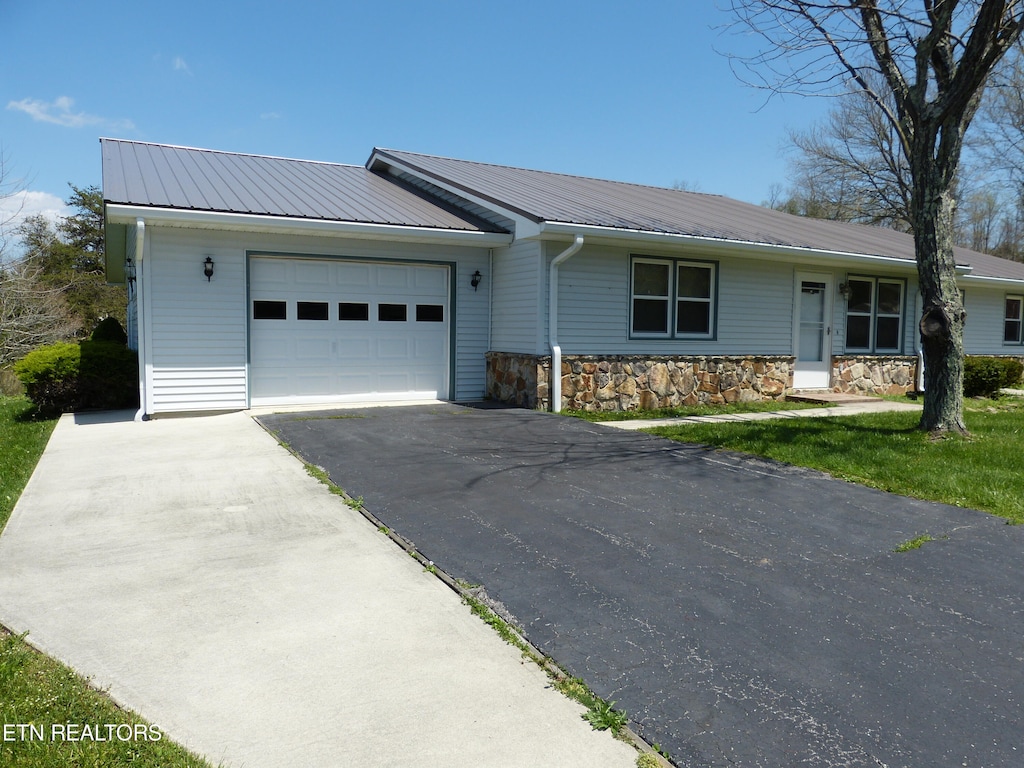 ranch-style home with a garage