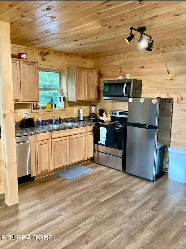 kitchen featuring wooden walls, wooden ceiling, light hardwood / wood-style flooring, and stainless steel appliances