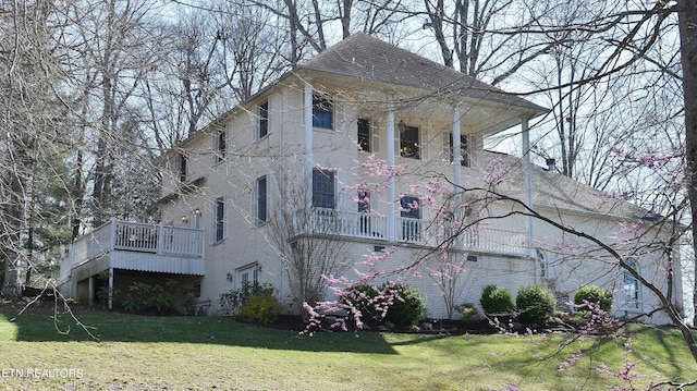 view of home's exterior with a yard