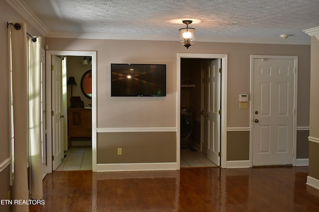 unfurnished room with ornamental molding, wood-type flooring, and a textured ceiling