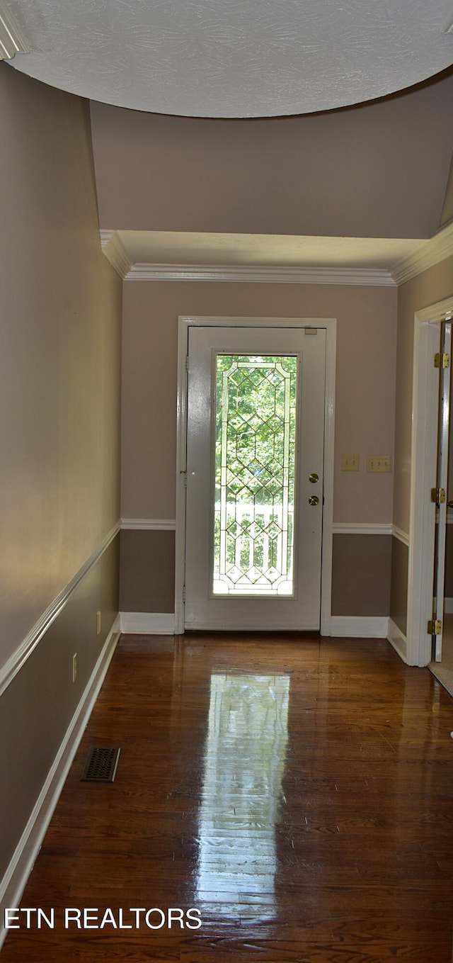 interior space with crown molding and dark wood-type flooring