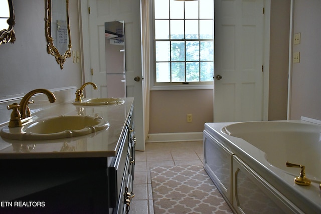 bathroom featuring vanity, a bathing tub, and tile patterned floors