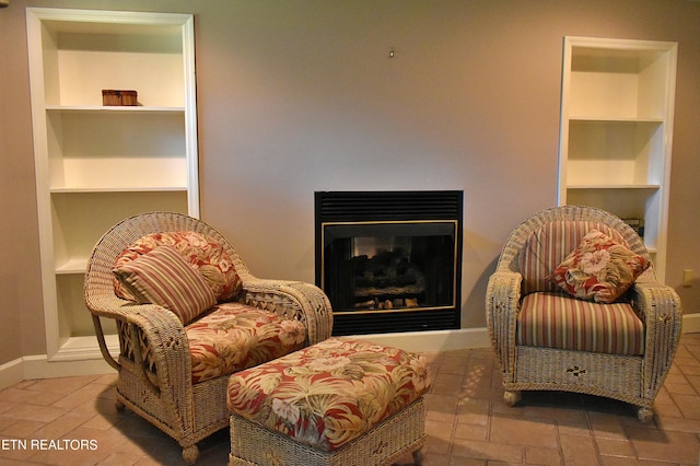 living area featuring built in shelves