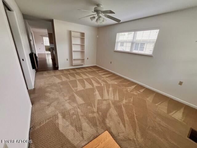 unfurnished bedroom with light carpet and ceiling fan