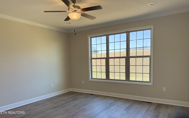 unfurnished room featuring ceiling fan, crown molding, and dark hardwood / wood-style flooring