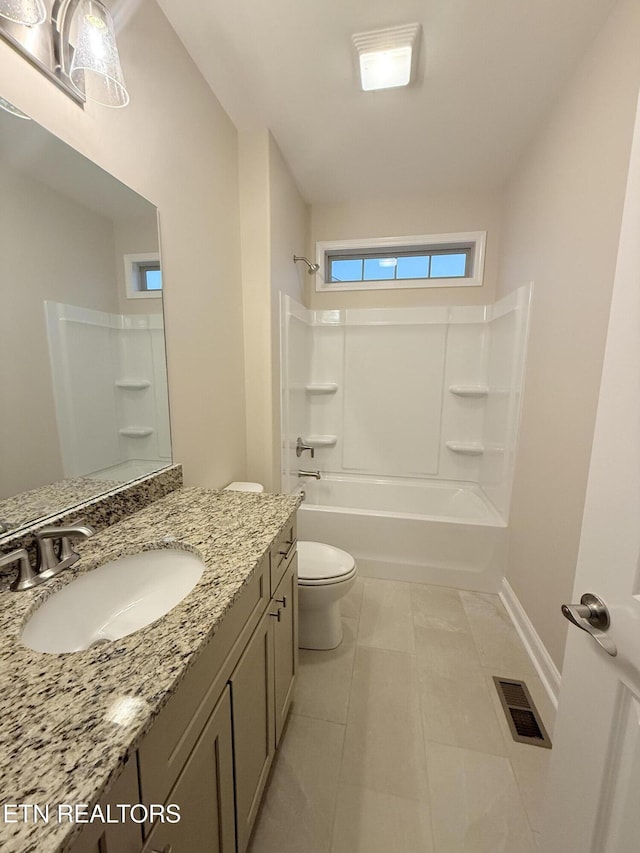 full bathroom featuring tile patterned floors, shower / bathing tub combination, vanity, and toilet