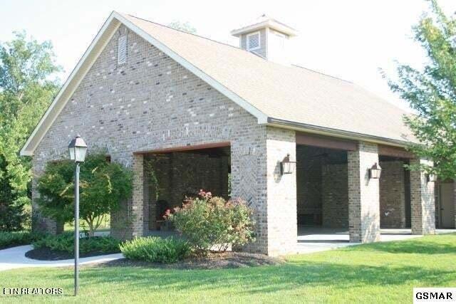 rear view of house with a yard