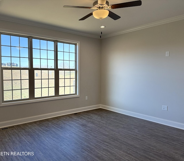 empty room with ceiling fan, dark hardwood / wood-style flooring, and ornamental molding