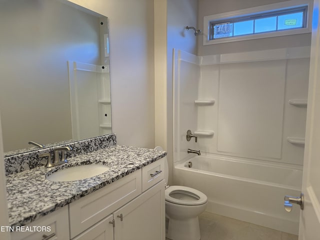 full bathroom featuring toilet, vanity, shower / washtub combination, and tile patterned floors