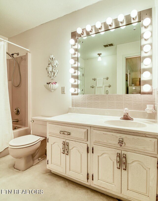 full bathroom featuring shower / bath combination with curtain, toilet, backsplash, and vanity