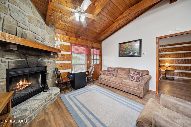 living room featuring lofted ceiling with beams, a fireplace, dark hardwood / wood-style floors, and wood ceiling